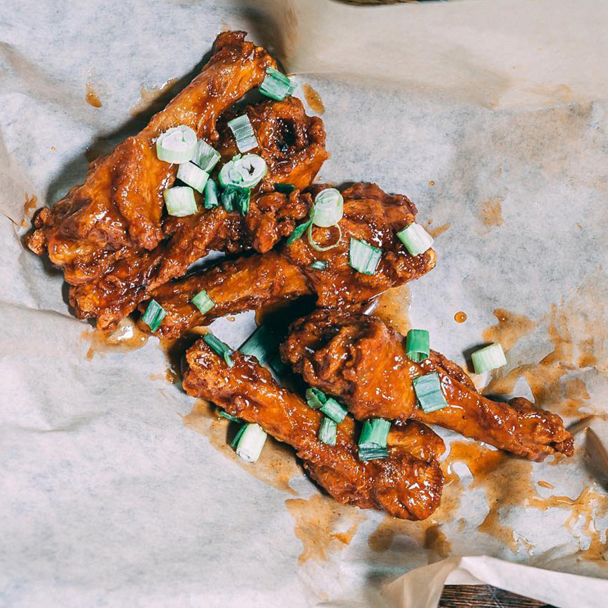 Duck wings tossed in Stingin' Honey Hot Sauce